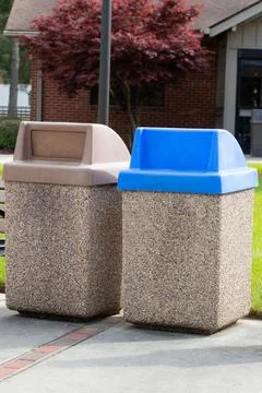 Garbage concrete stone bin on the sidewalk Stock Photos