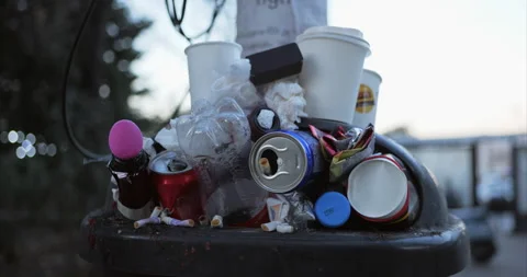 Garbage container filled to top with various of waste. Plastic, cans, bottles Stock Footage 229952241