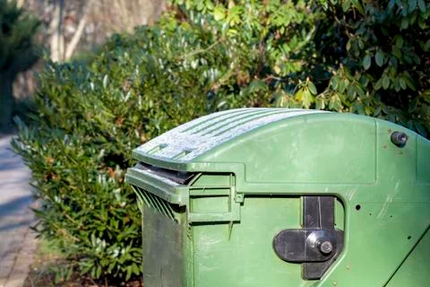 Garbage container in the park of the city cemetry Stock Photos