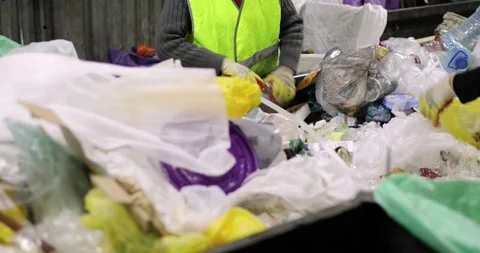 Garbage container. A pile of various rubbish, plastic, cellophane. People in Stock Footage 156080308