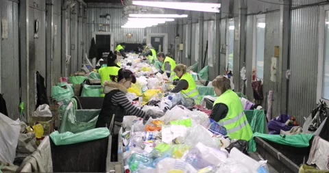 Garbage containers are indoors. A pile of various rubbish, plastic, cellophane Stock Footage 156078622