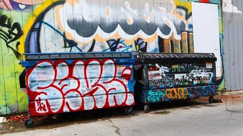 Garbage Containers with Graffiti Stock Photos