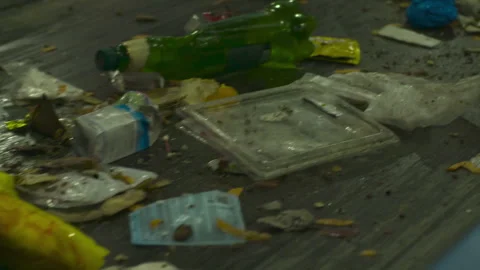 Garbage on the conveyor of the waste processing plant. Recycling plant. Stock Footage 102485157
