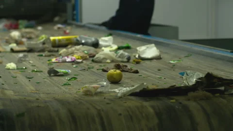 Garbage on the conveyor of the waste processing plant. Recycling plant. Stock Footage 102485596