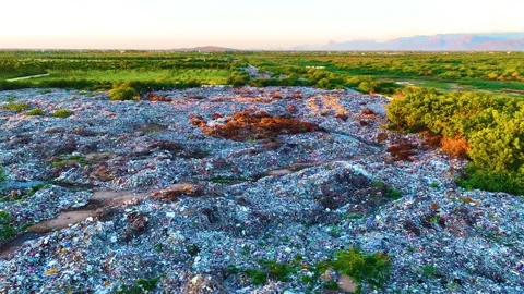 Garbage Dump - Aerial View By A Drone Leftwards During Sunrise 库存影片 251698748