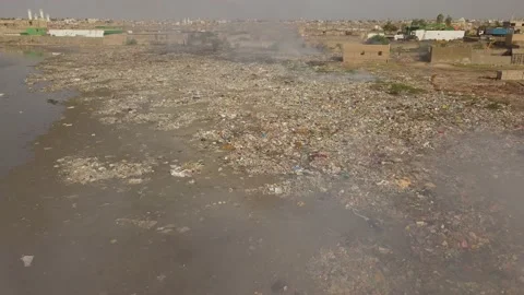 A Garbage dump on the banks of the Saloum River - Kaolack - Senegal Stock Footage 165357782