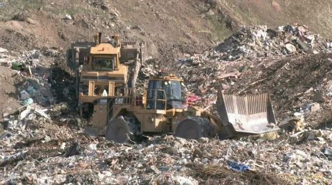 Garbage dump bull dozers P HD Stock Footage 128853