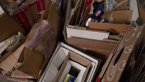 Garbage dump, cardboard boxes. Close-up. Waste recycling. Environmental Video stock 168076333