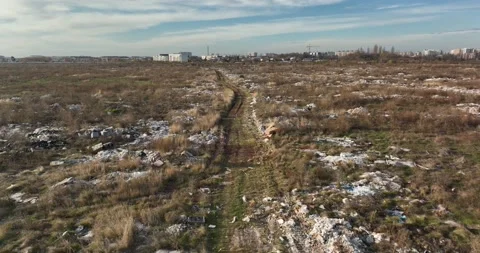 Garbage dump. City of Bucharest on hte background. Enviroment pollution concerns Stock Footage 198213430
