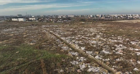 Garbage dump. City of Bucharest on hte background. Enviroment pollution concerns Stock Footage 198213544