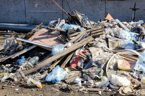 Garbage dump in the city. Pollution of the human environment. Stock Photos