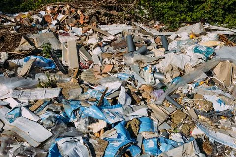 Garbage dump with construction rubbish and rubbish in the forest Stock Photos
