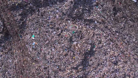 Garbage dump full of plastic trash and unsorted garbage, waste piles. Landfill Stock Footage 295954880