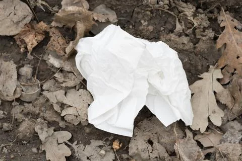Garbage dump on the grass near the forest ecological disaster concept polluti Foto stock