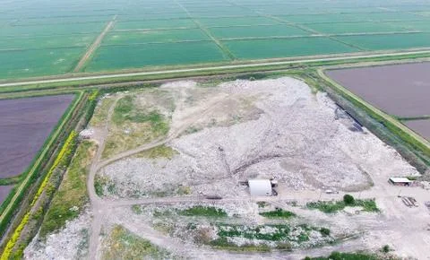 Garbage dump with heaps of garbage and treatment facilities. Landfill of garb Stock Photos