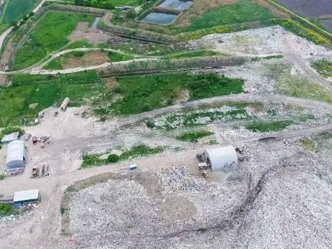 Garbage dump with heaps of garbage and treatment facilities. Landfill of garb Stock Photos