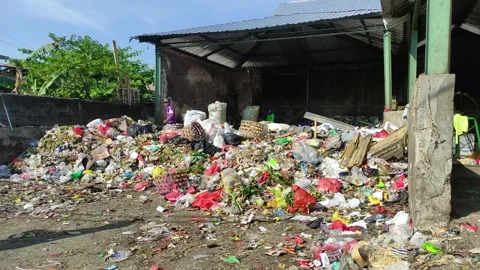 Garbage dump, landfill cleaners sorting the accumulated residential waste. Video stock 245402579