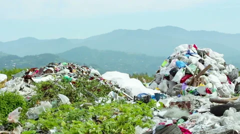 Garbage dump with mountains on background Stock Footage 50637701