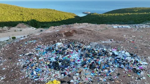 Garbage dump at the seaside from above, aerial view of industrial landfill Stock Footage 196275491