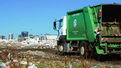 Garbage dump. Skyscrapers, construction site with crane and houses of big city 動画素材 164324364