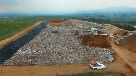 Garbage Dump Trucks and Dozers Stock Footage 65158106