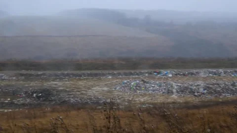 Garbage dump. Unauthorized waste dump. Winter, wet snow is falling. 스톡 동영상 258223744