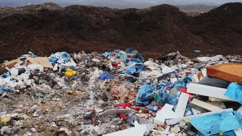 Garbage dump with waste plastic, polyethylene and food waste. Stock Footage 232614866