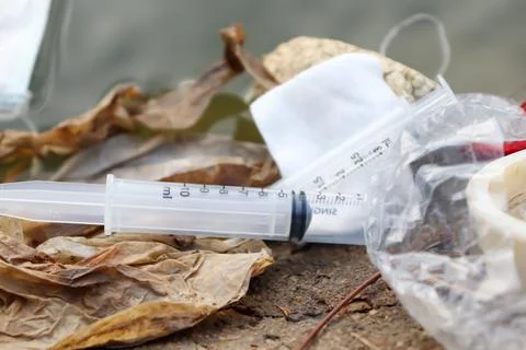 Garbage is dumped into the river Stockfoto's