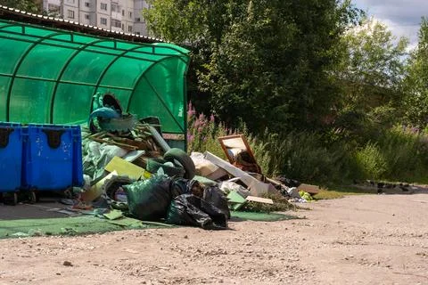 Garbage dumping and pollution around a neighborhood waste collection point Stock Photos
