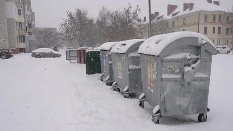 Garbage dumping bins in the yard, it is snowing, winter, background, pollution Stock Footage 117421529