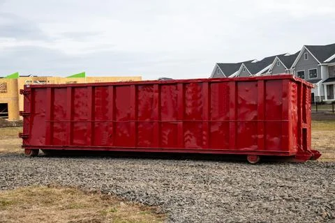 Garbage dumpster at a construction site Stock Photos