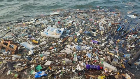 Garbage floating on the coast. Concept of sea ocean water pollution. Stock Footage 171618000
