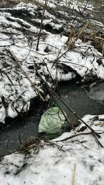 Garbage Floating in Lake and Stream Water Pollution Stock Photos