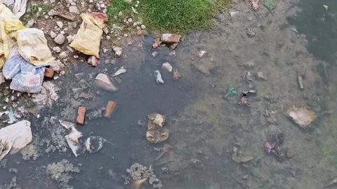 Garbage Floating in Polluted Water With Plastic Waste Видео 330325327