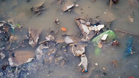 Garbage floating on the river. river that has a plastic waste. 動画素材 114145120