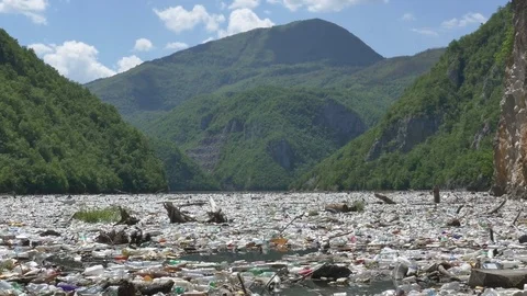 Garbage floating in a rivers 8 Stock Footage