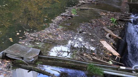 Garbage gathered at the river crossing Stock Footage 96127329