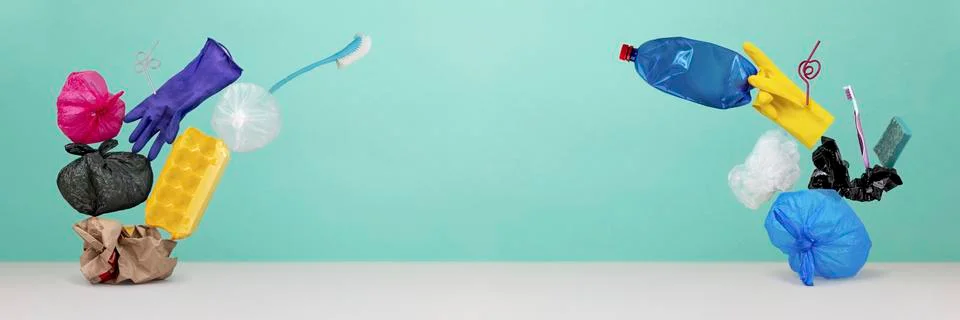 Garbage on green background Stock Photos