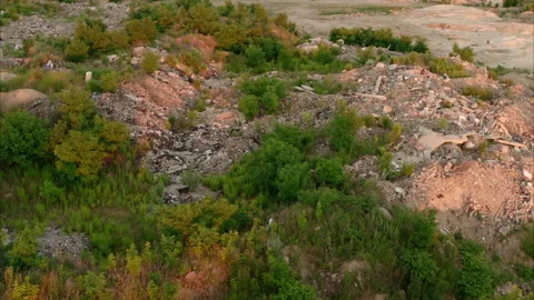 Garbage in an illegal dump. Aerial view. Plastic soil contamination Video stock 133590008
