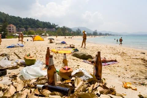 Garbage lying on the beach. Stock Photos