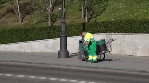 Garbage man picking up litter Stock Footage 69110370