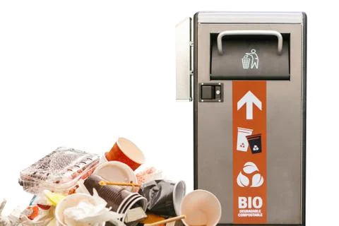 Garbage next to a modern garbage can. The concept is protected by nature and the Stock Photos