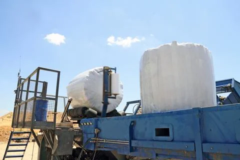 Garbage packing machine in landfill Stock Photos