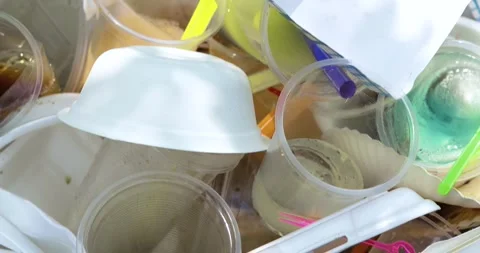 Garbage pile, Disposable plastic cups and containers highlighting pollution Stock Footage 335083500