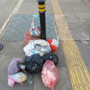 Garbage piled up on the side of the road Stock Photos