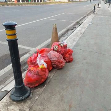 Garbage piled up on the side of the road Stock Photos