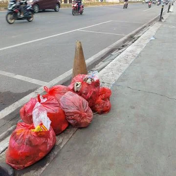 Garbage piled up on the side of the road Stock Photos