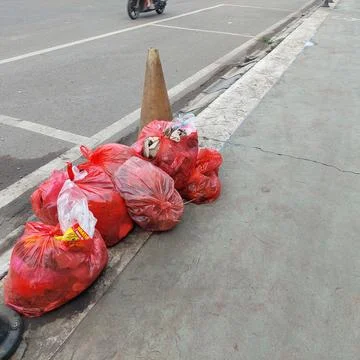 Garbage piled up on the side of the road Stock Photos