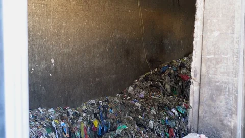 Garbage pit in a garbage recycling plant, bottom view Video stock 118930340