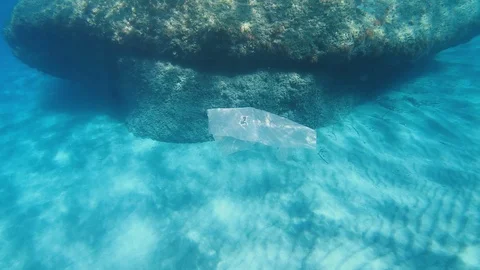 Garbage. Plastic bag pollution by the sea. Video stock 123241870